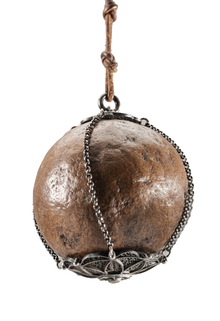 An Indian bezoar stone with silver and silver filigree mounts